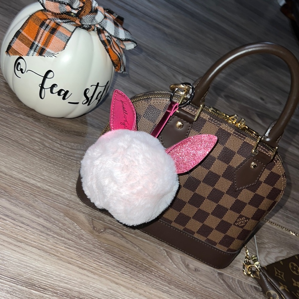 Kendall and Kylie pink Pom Pom bagcharm